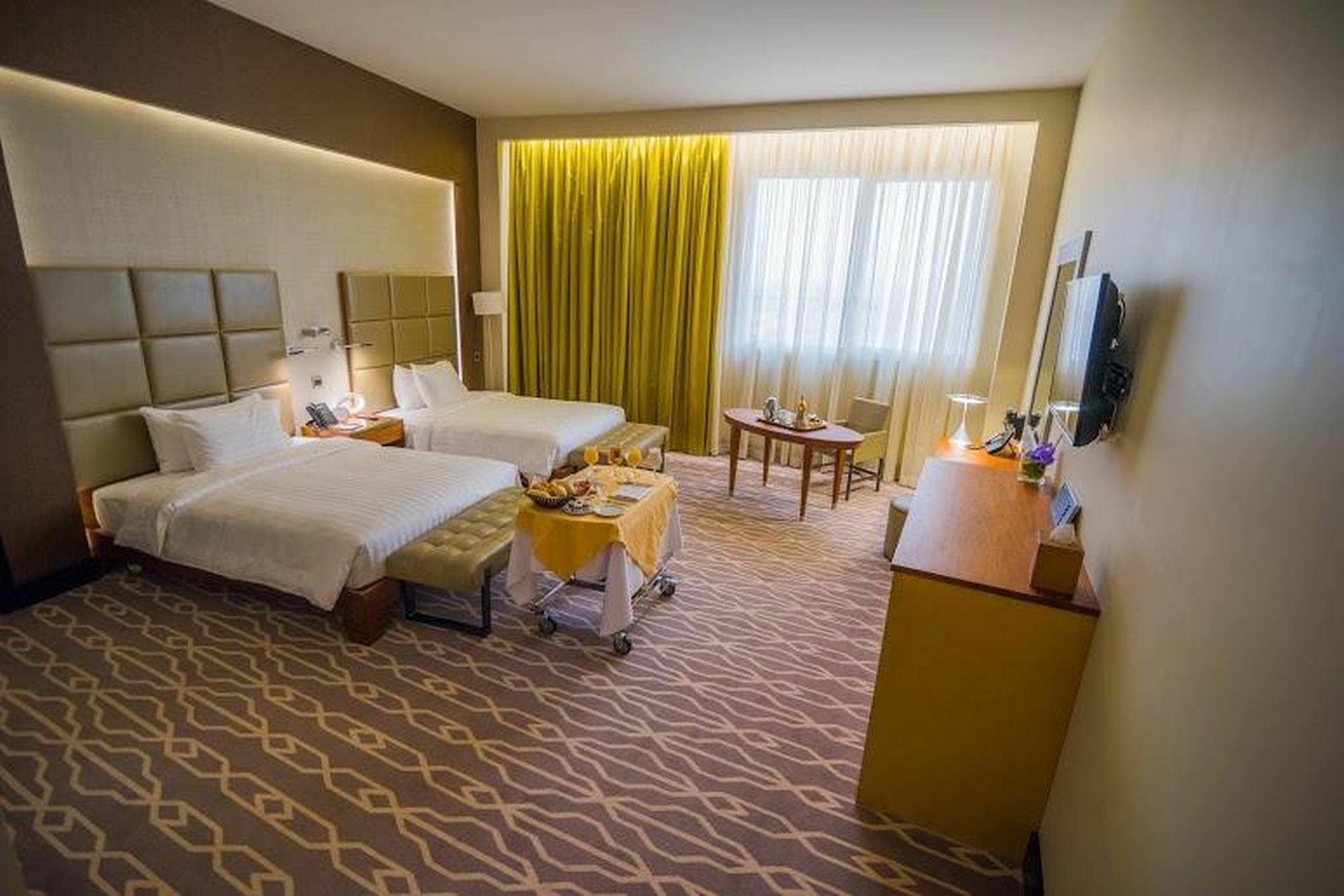 Millennium Hail Hotel Exterior photo A room at the hotel